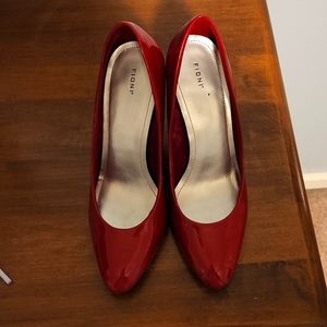 Red patent leather pumps